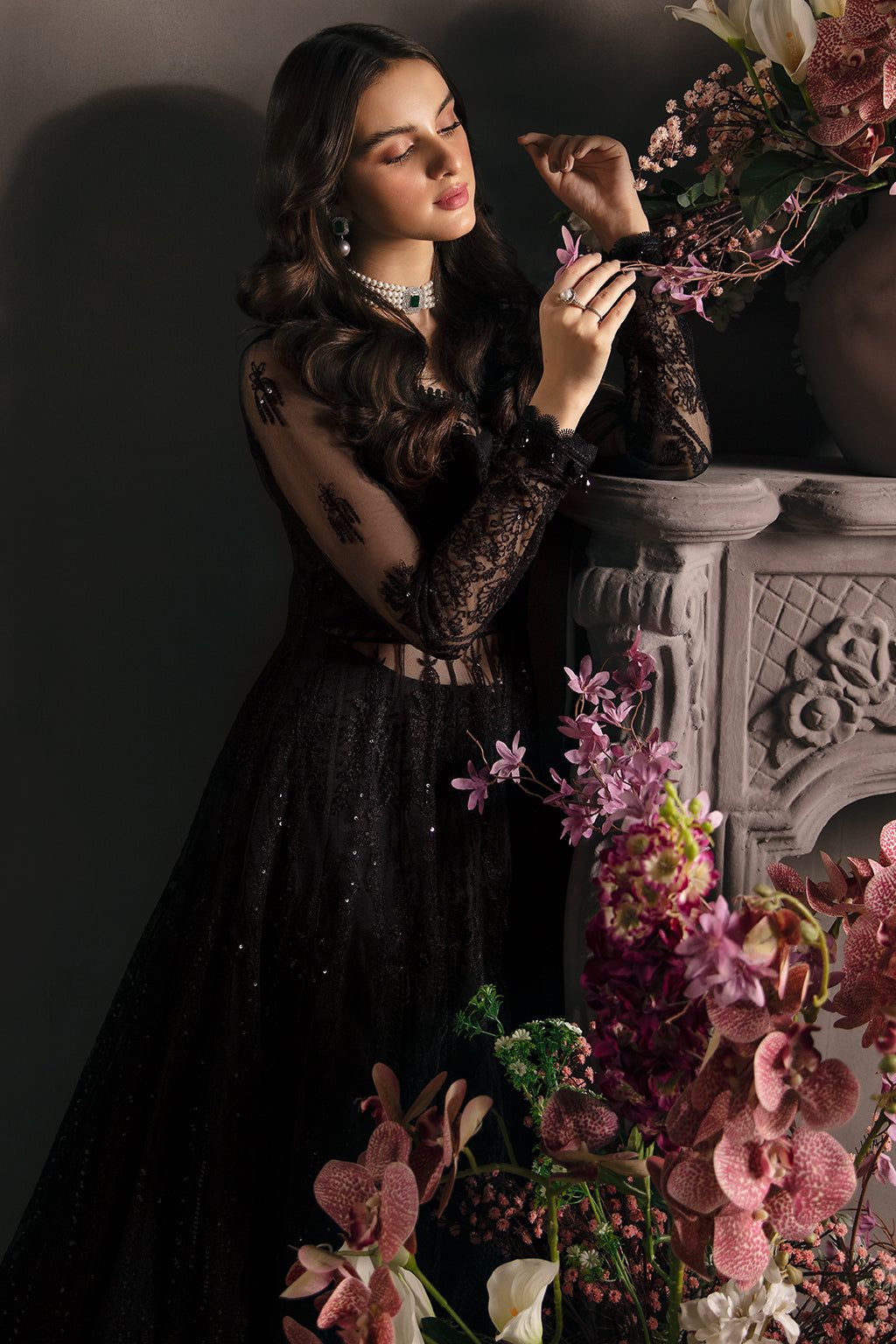 afrozeh black dress Parizaad In a deep midnight black fabric, this threepiece set radiates elegance through its contrast of light and dark. The shirt, tailored in flowing traditional style, is adorned with intricate white embroidery